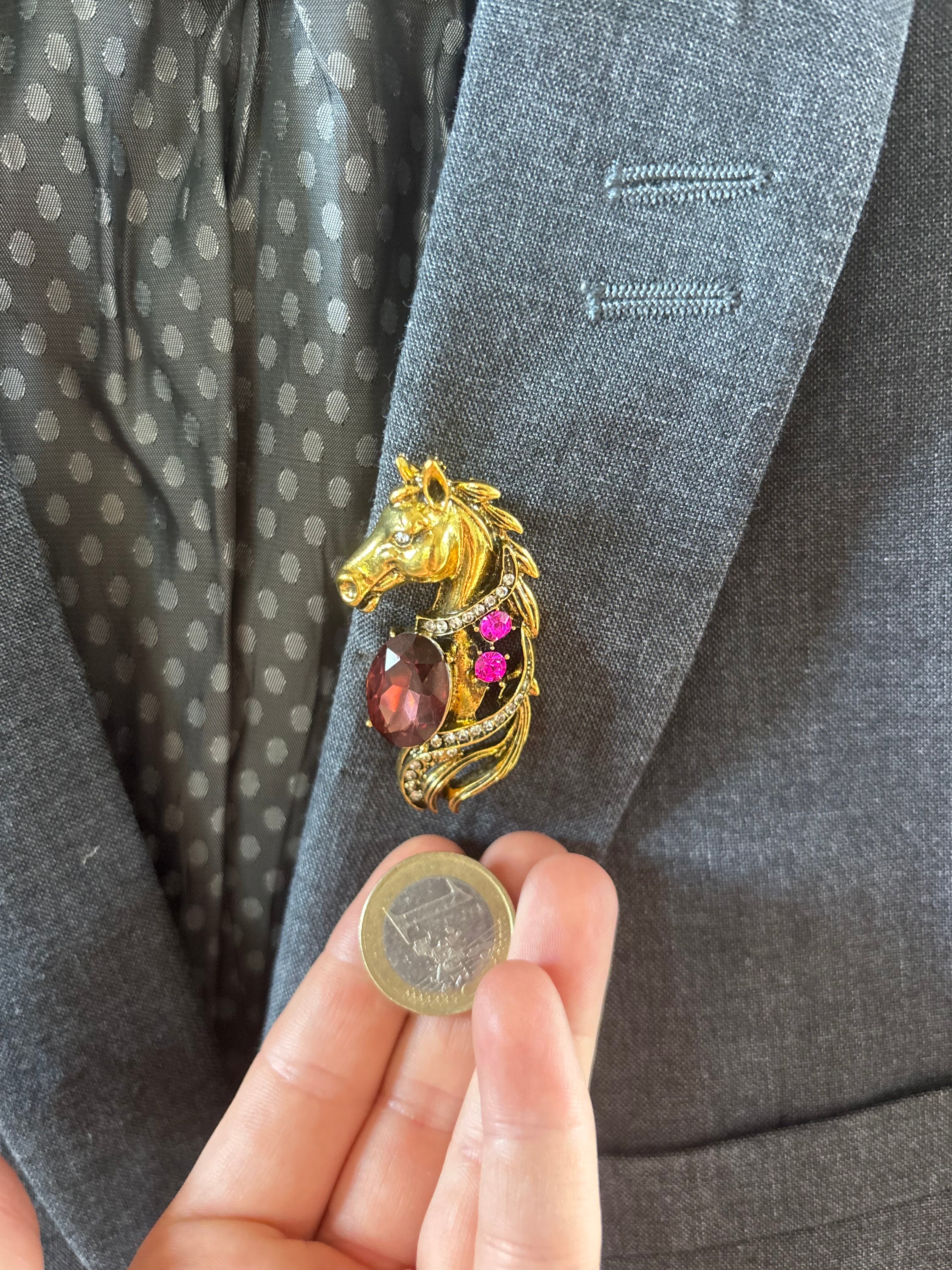 Gold tone horse brooch