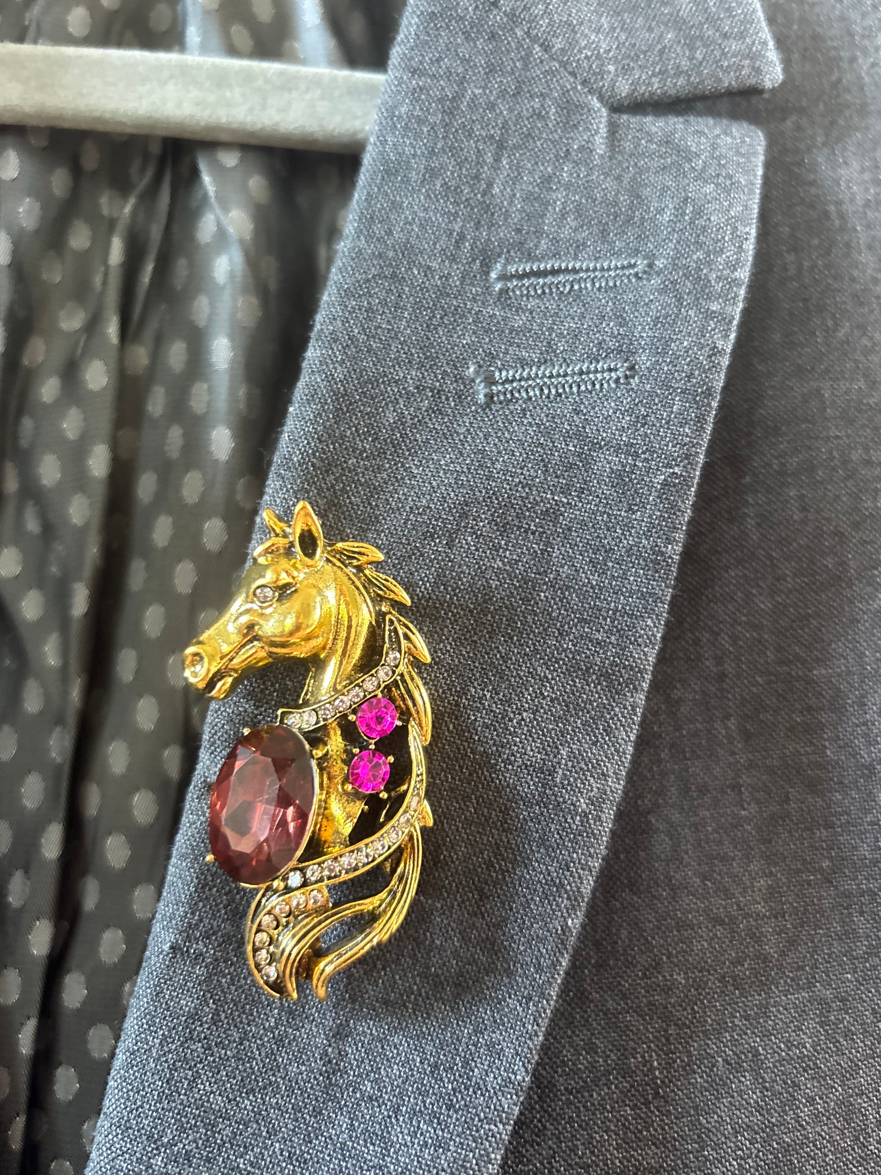 Gold tone horse brooch
